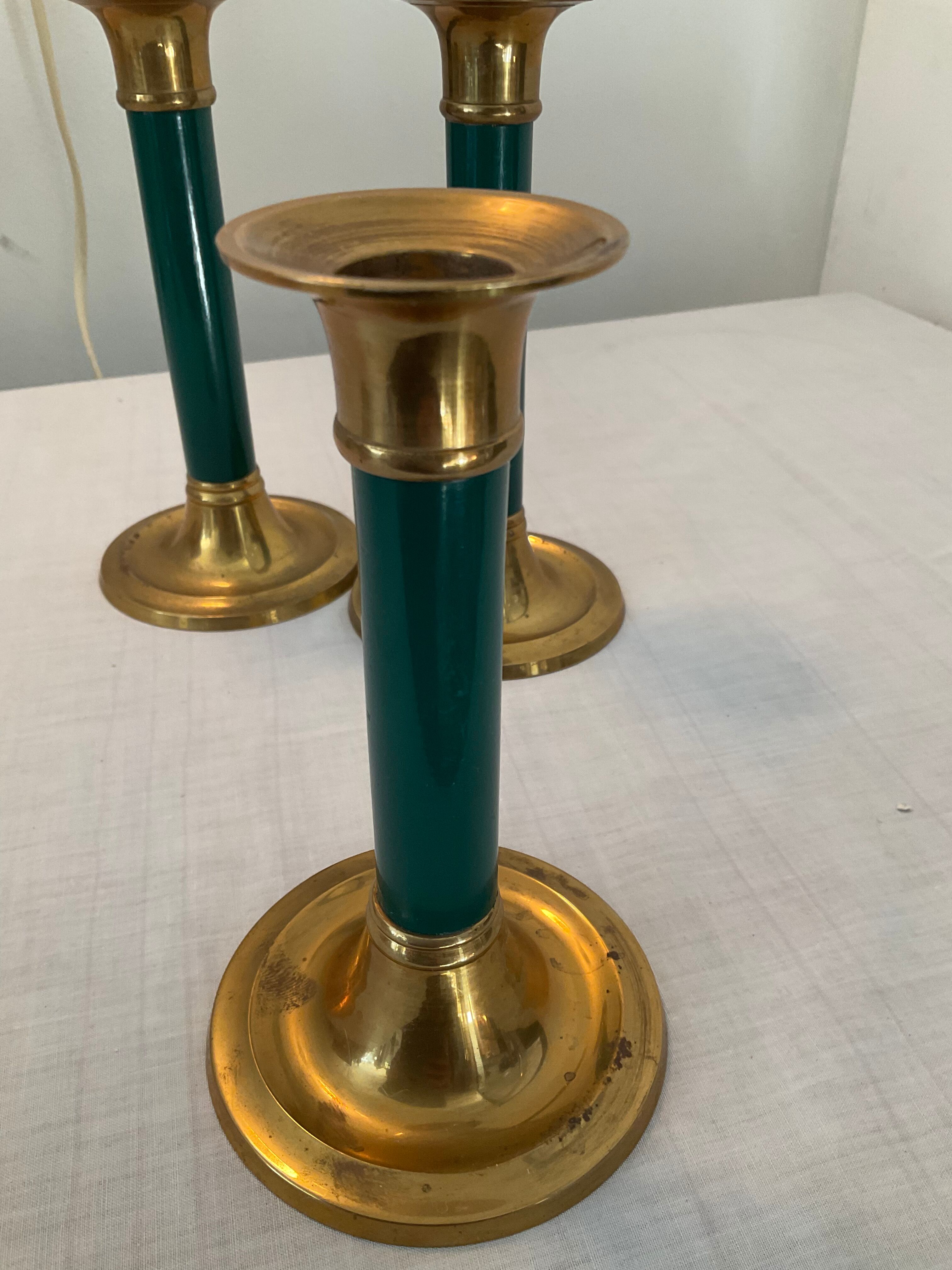 Trio of vintage bronze candle holders