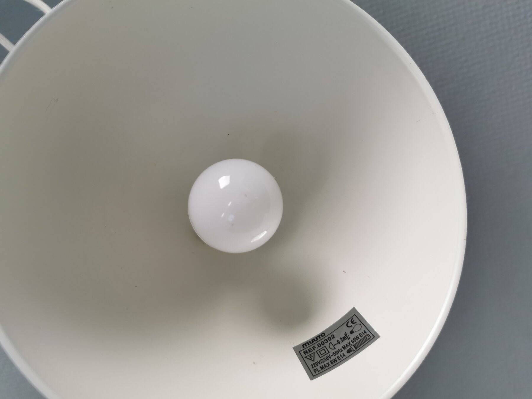 Two purple hanging lamps from Norway Says for Muuto, model Mhy