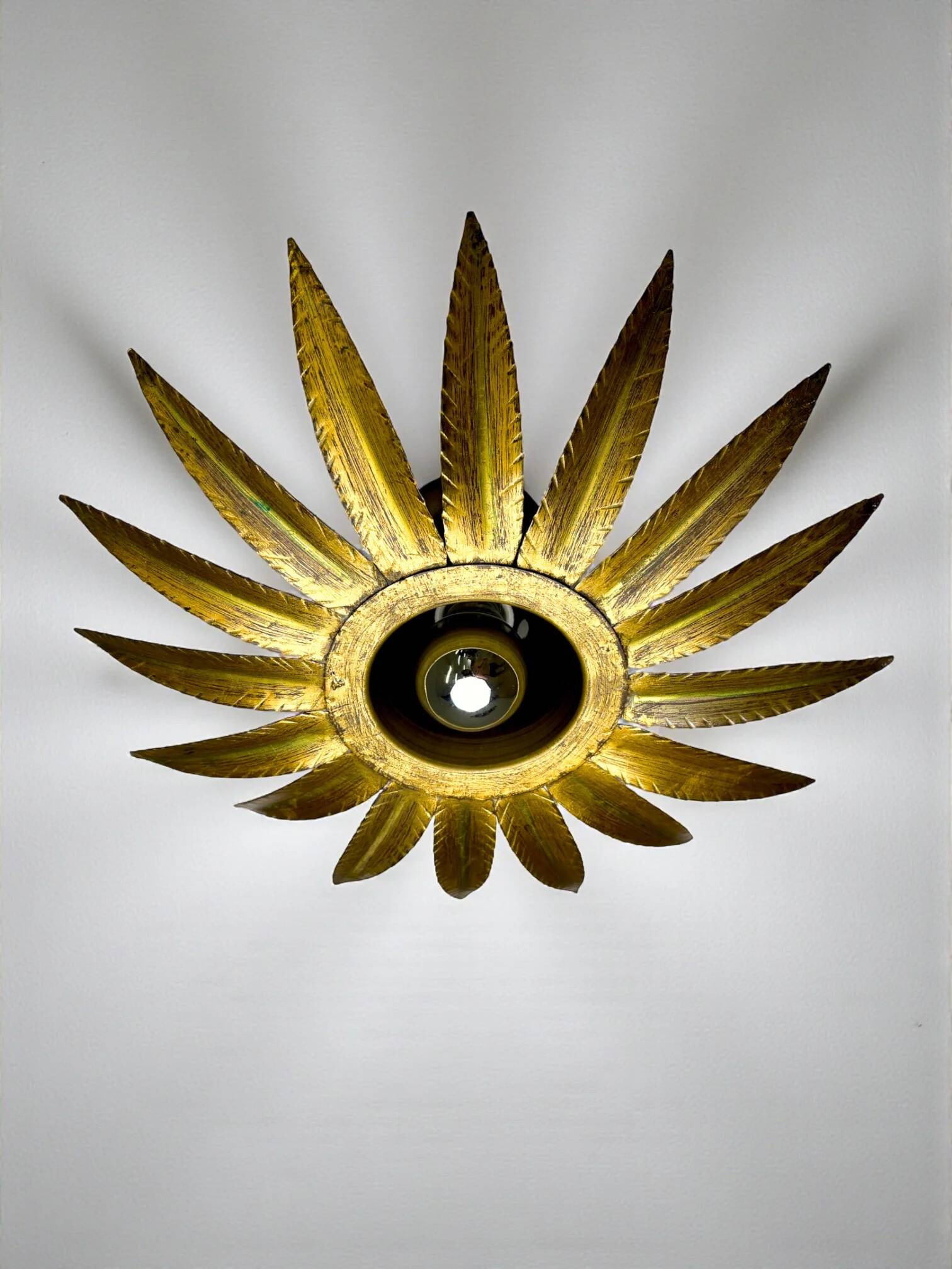 Spanish sunburst flush mount light fixture in gilt iron, Ferro Art, 1960s