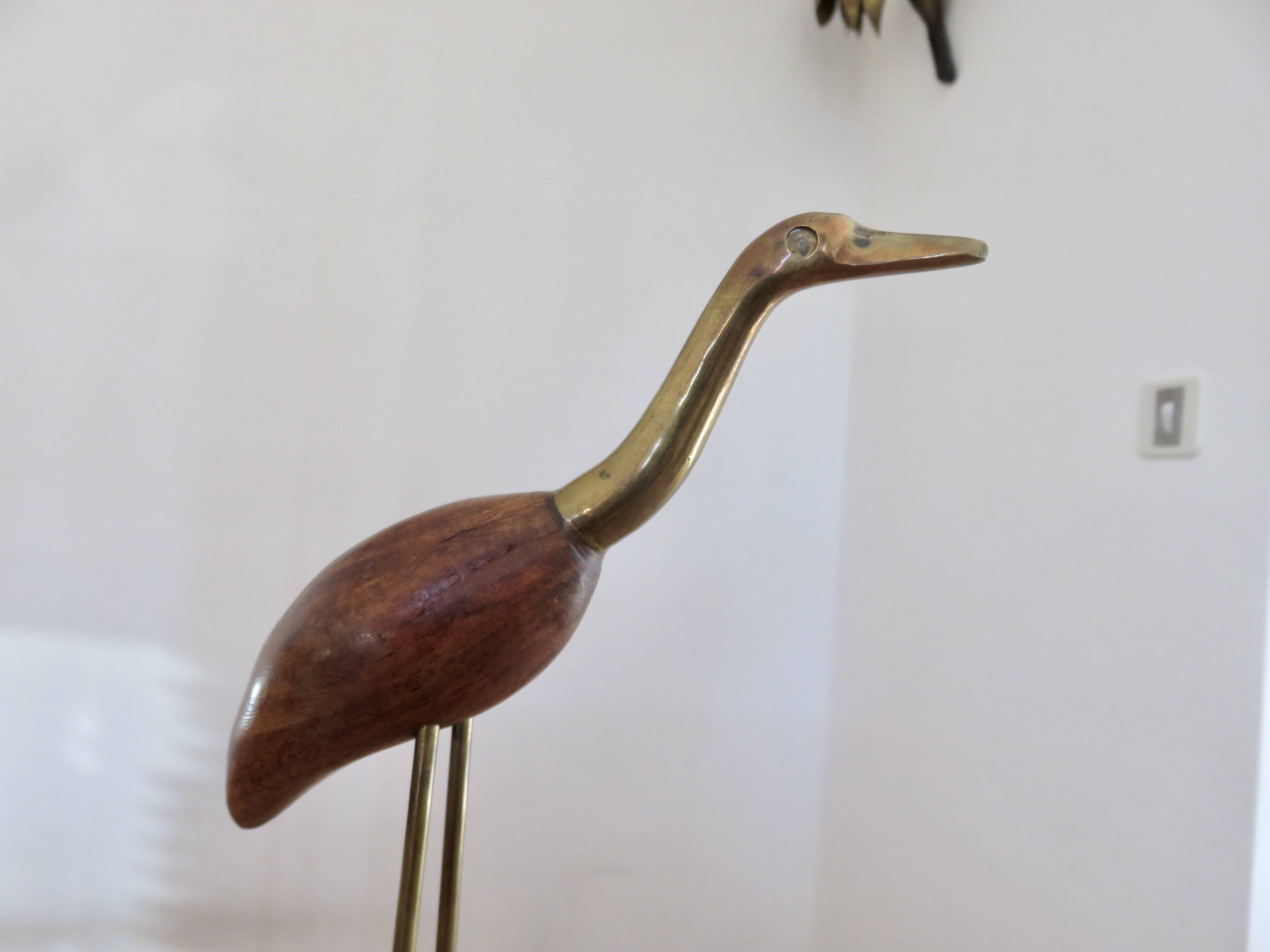Pair of teak and brass herons from the 70s