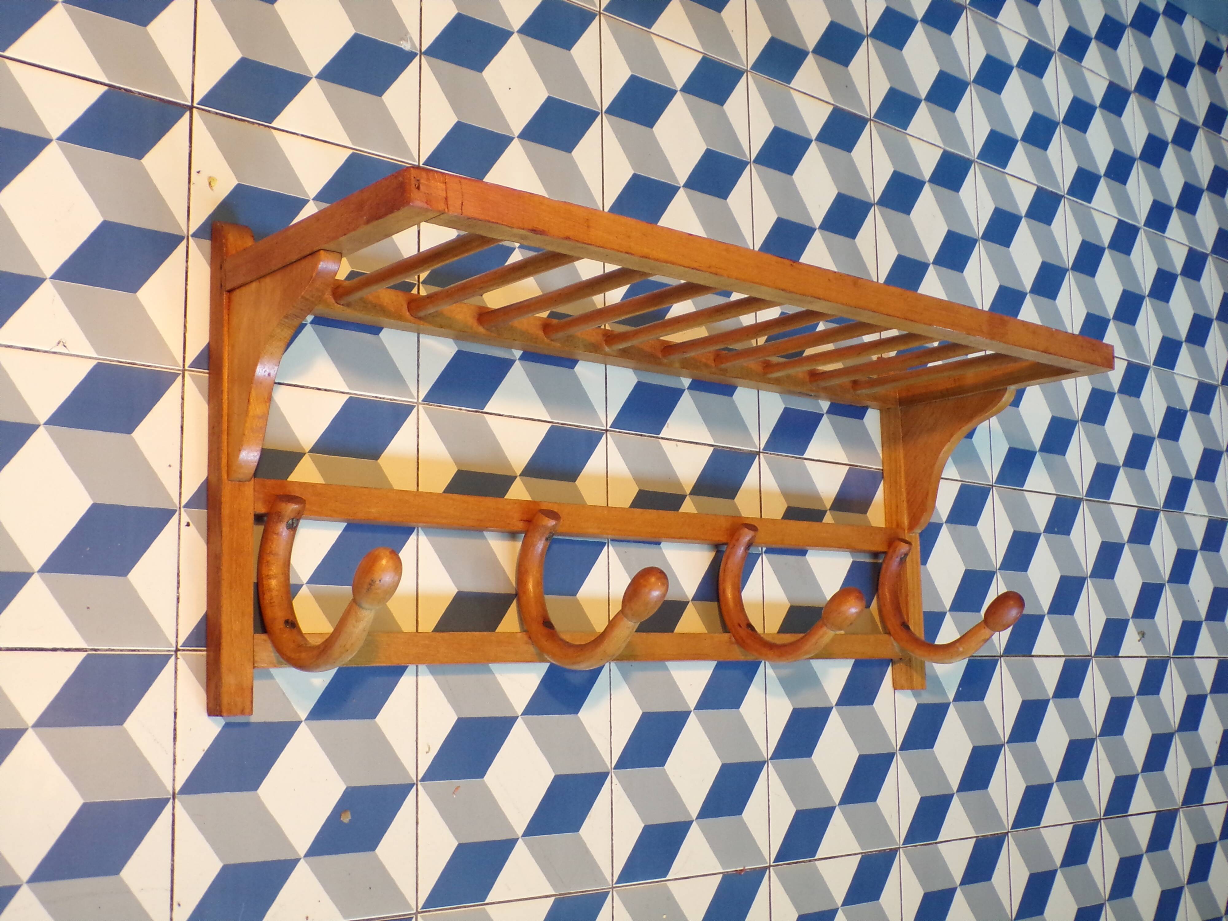 Curved wooden coat rack with shelf