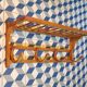 Curved wooden coat rack with shelf