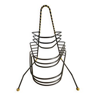 Black metal vinyl record holder and yellow scoubidou from the 60s