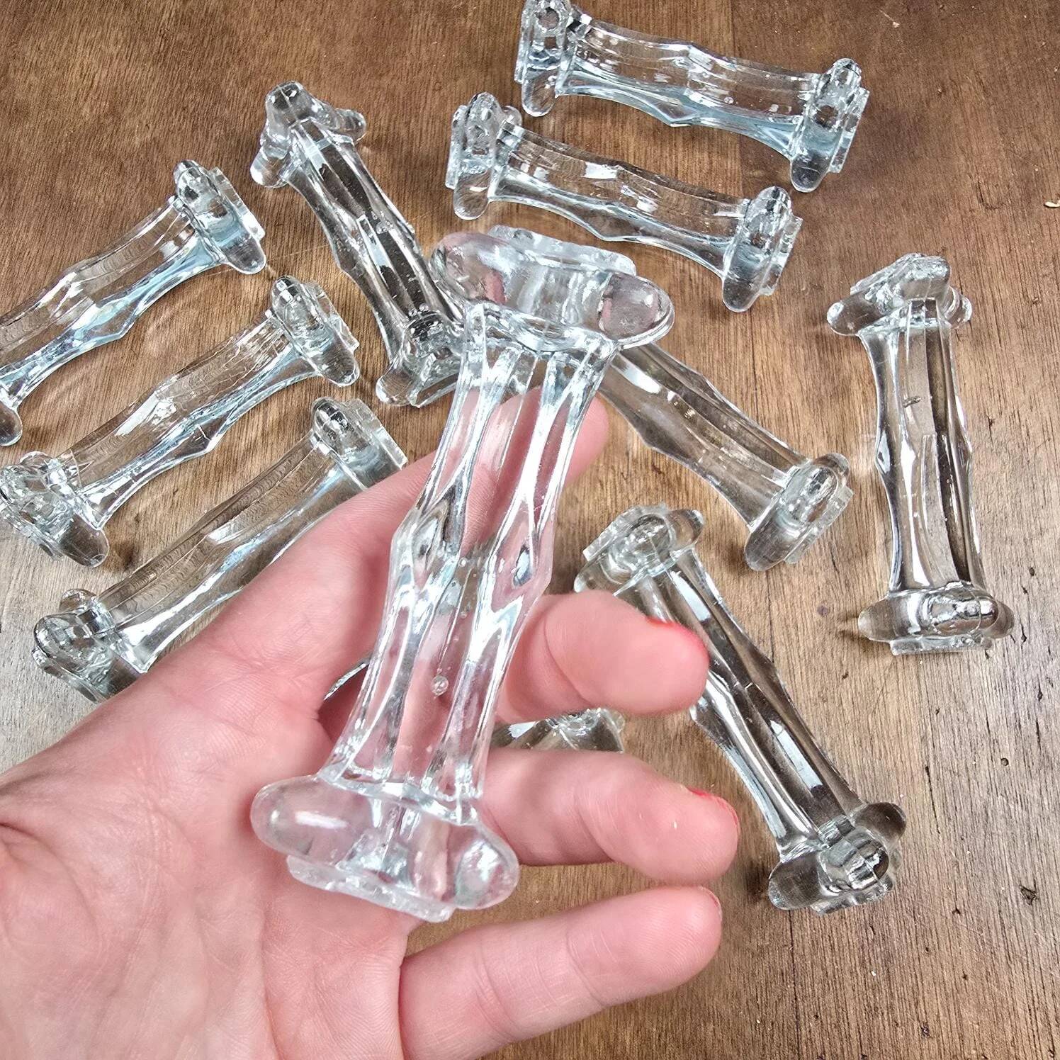 Set of 12 antique knife and fork rests in thick transparent glass.