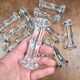 Set of 12 antique knife and fork rests in thick transparent glass.