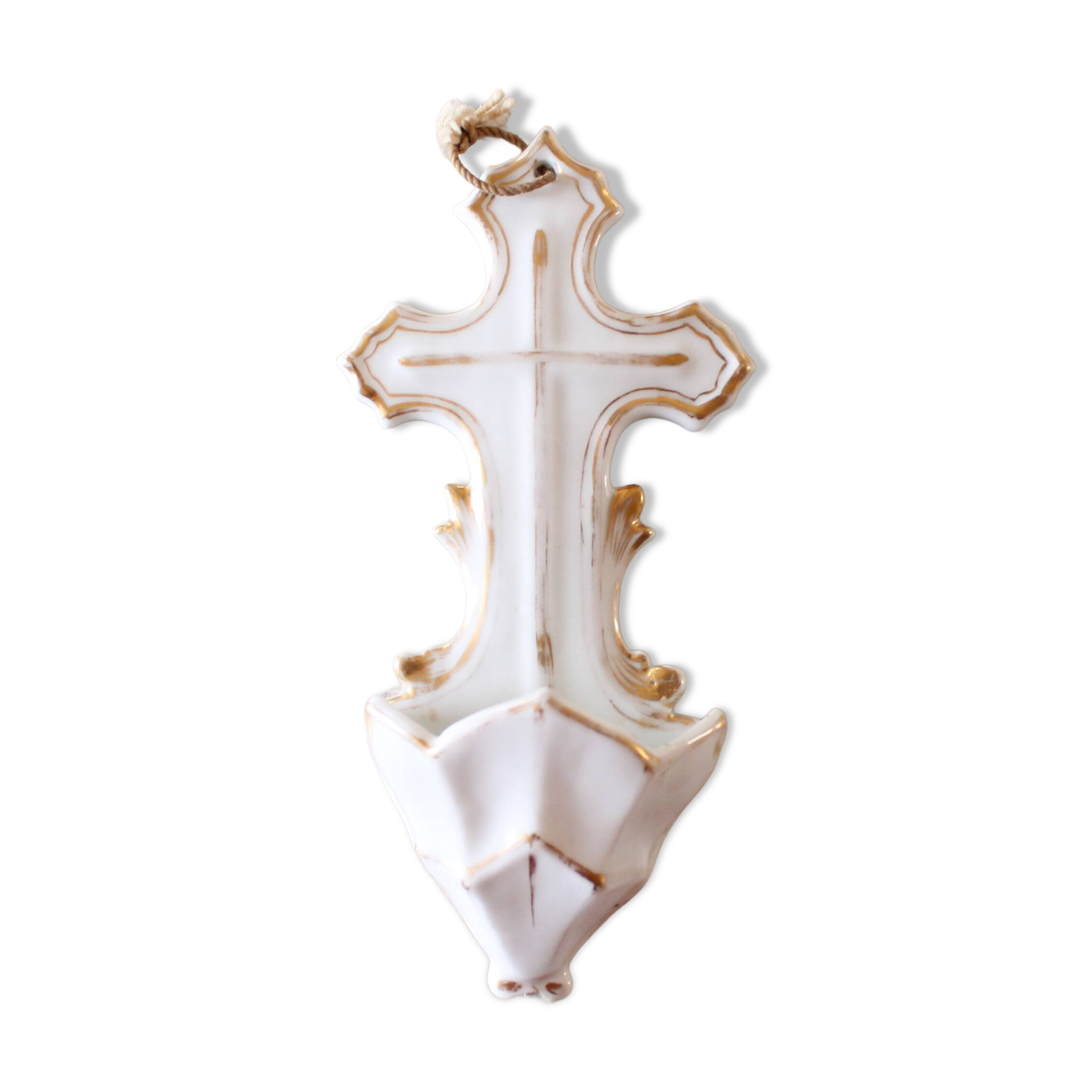 Antique holy water font in white porcelain biscuit.