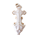 Antique holy water font in white porcelain biscuit.