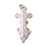Antique holy water font in white porcelain biscuit.