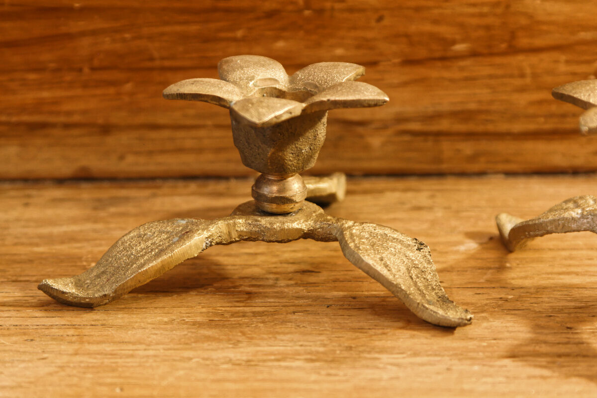 Pair of brass candle holders, flowers