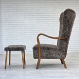 1960s, reupholstered Danish armchair, with stool, genuine sheepskin.