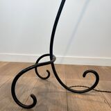 Design floor lamp in black lacquered metal and brass.