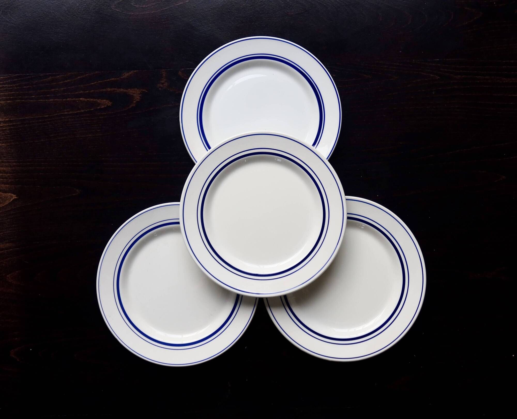 4 vintage bistro style flat plates in blue and white porcelain