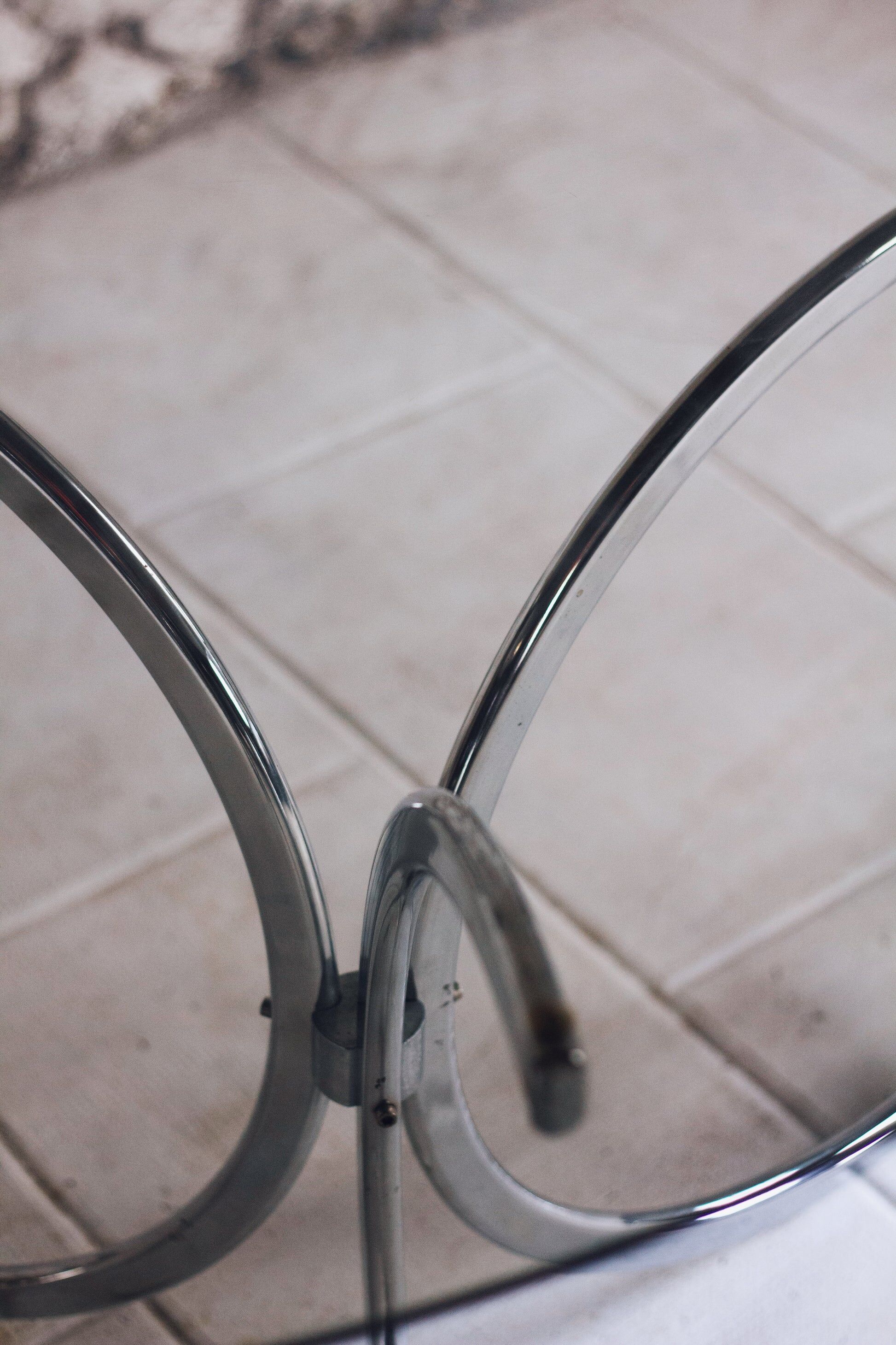 Chrome and smoked glass dining table in the style of Gastone Rinaldi, 1970.