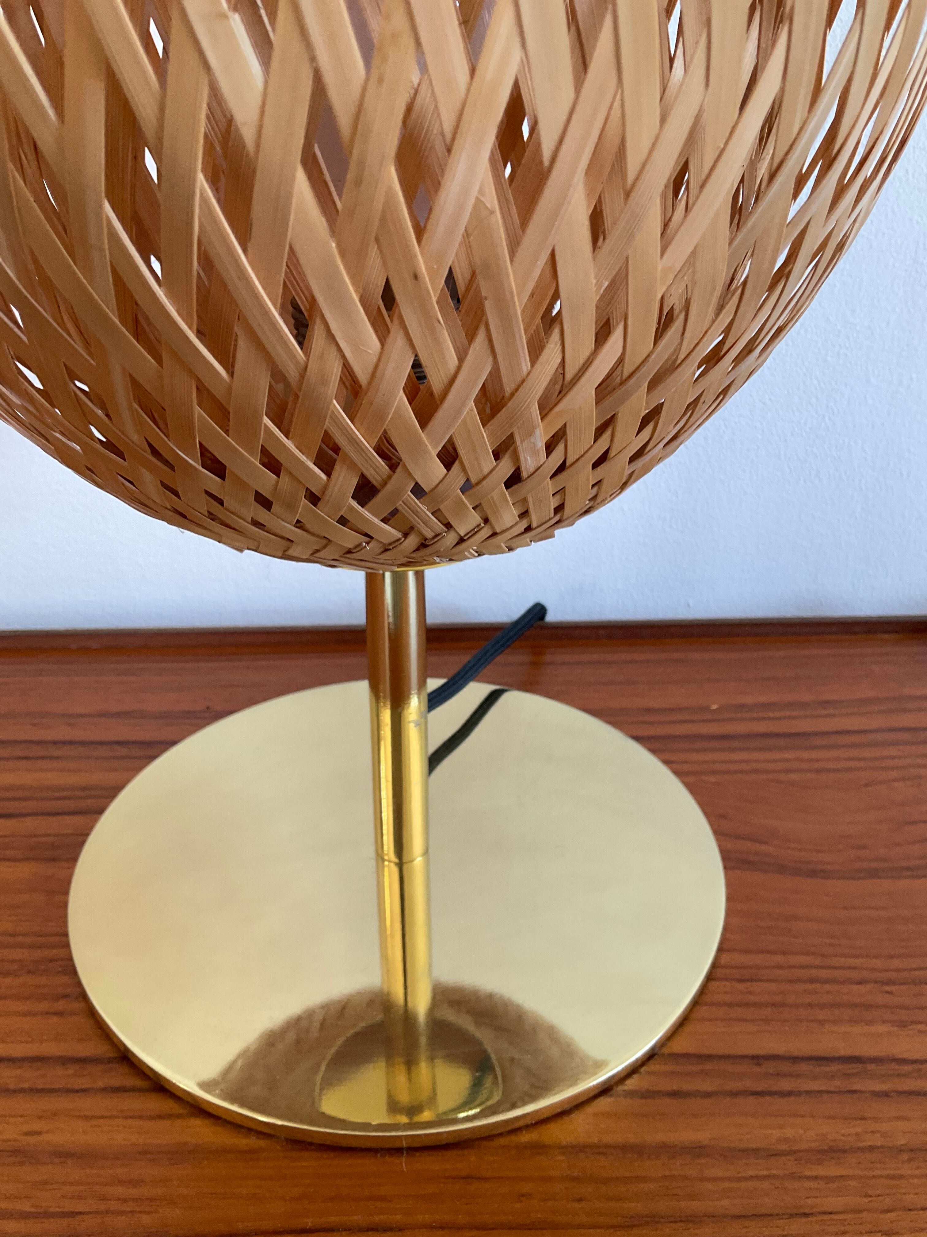 Design lamp in gold metal and wicker