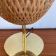 Design lamp in gold metal and wicker