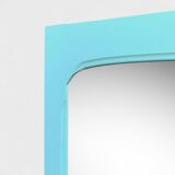 Beveled mirror on turquoise Parisian door