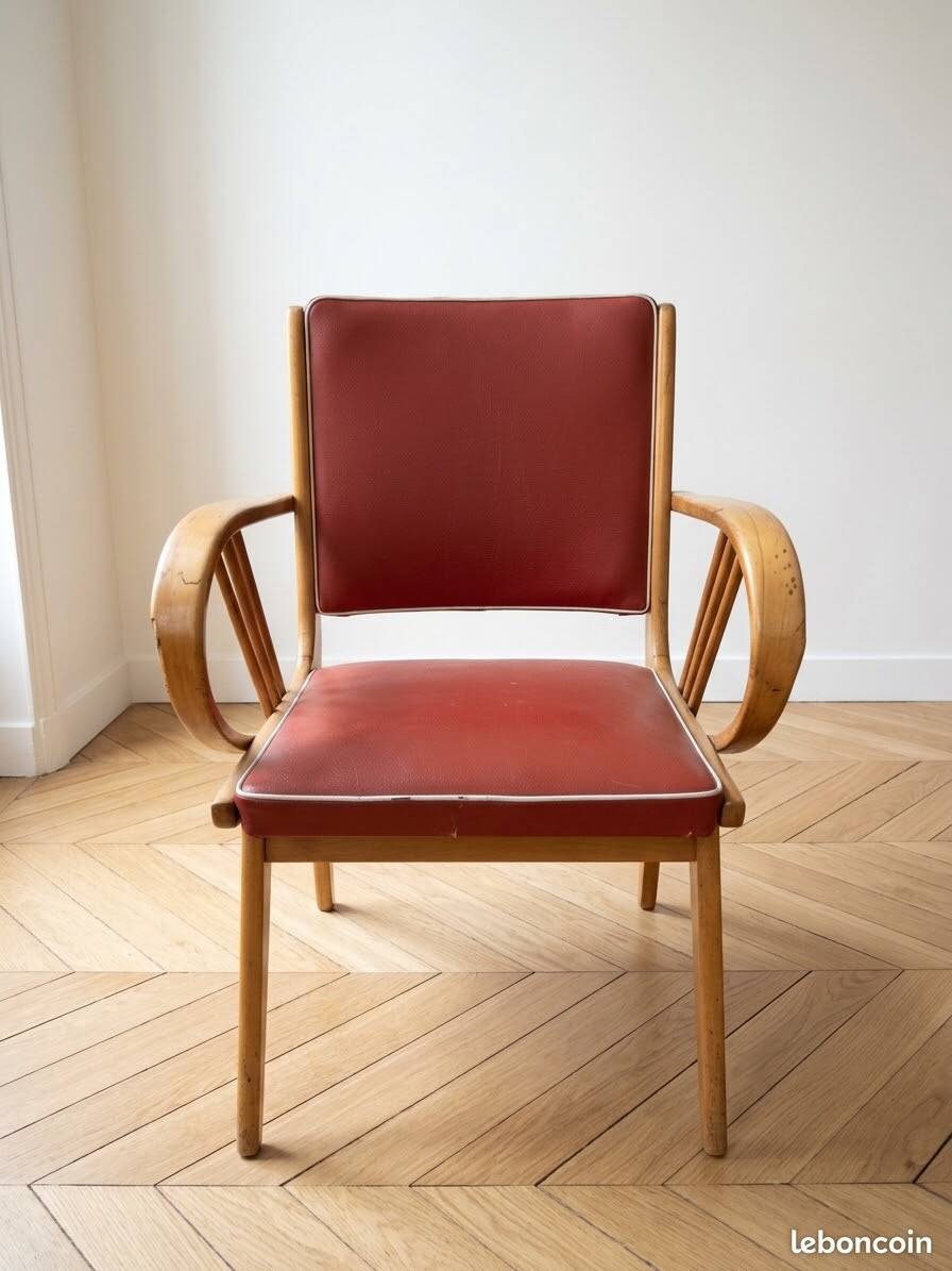 Vintage 1950s armchair in wood and red faux leather.