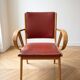 Vintage 1950s armchair in wood and red faux leather.