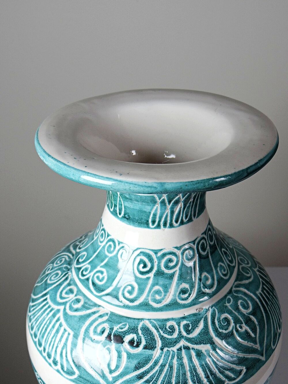 Vintage turquoise ceramic baluster vase with incised decoration.
