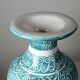 Vintage turquoise ceramic baluster vase with incised decoration.