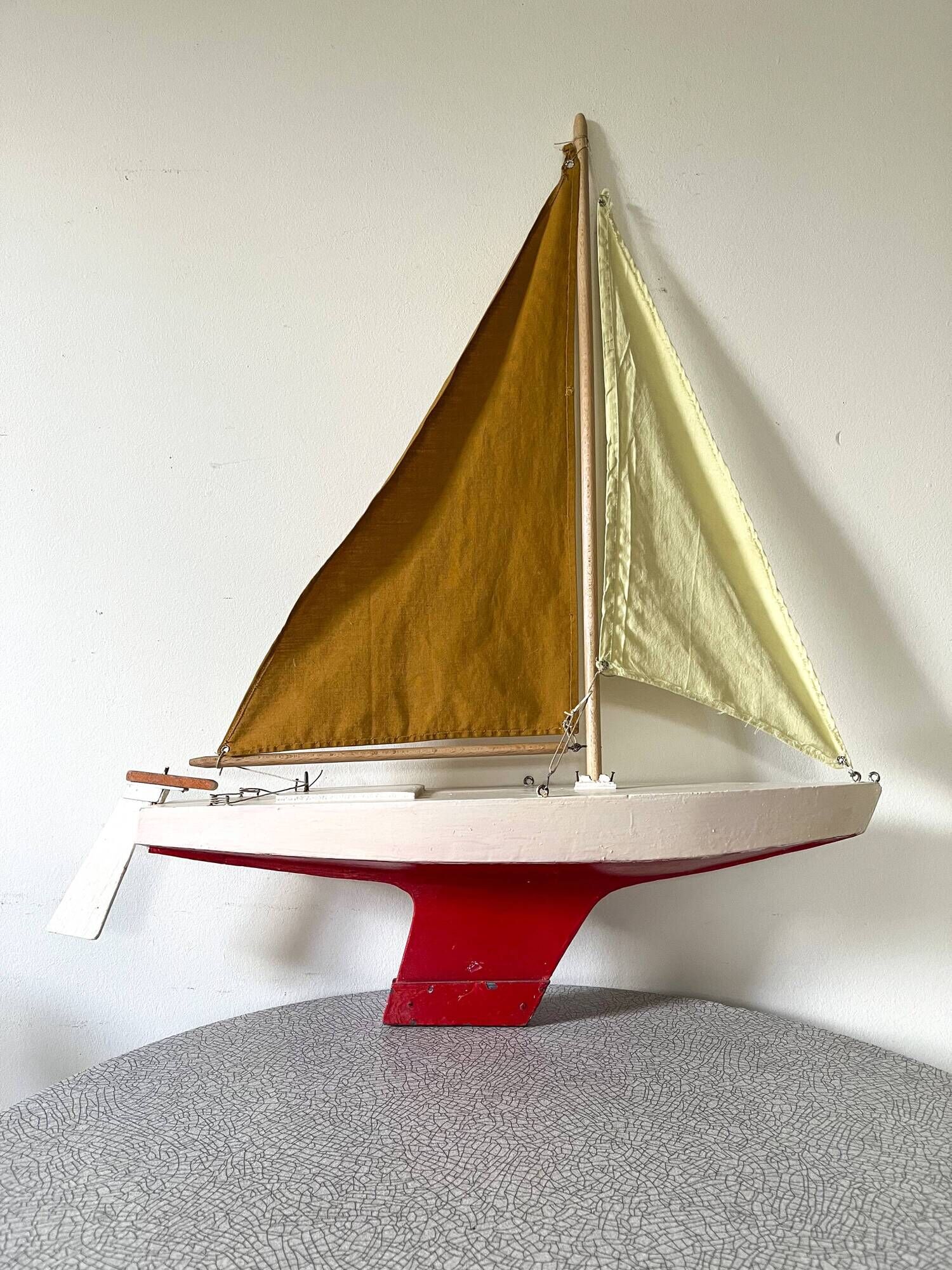 Navigable wooden sailing ship with pretty vintage colors