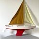 Navigable wooden sailing ship with pretty vintage colors