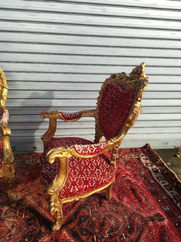 pair of gilded wooden ceremonial chairs