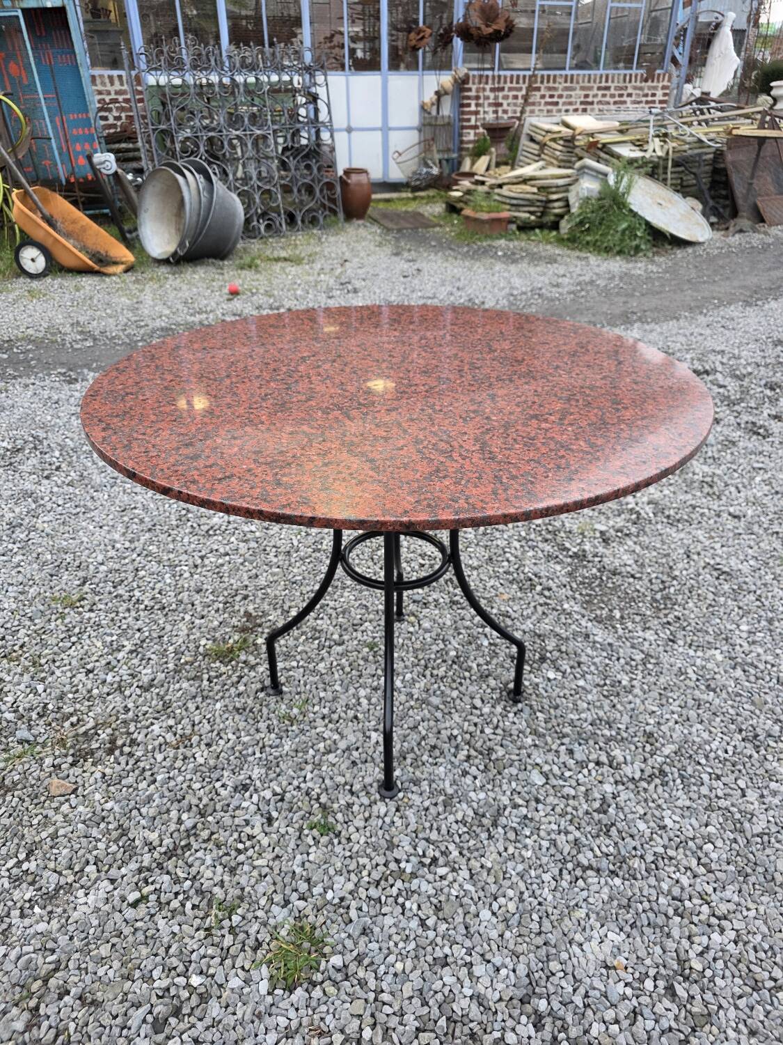 Round marble table with wrought iron base from the mid-20th century.