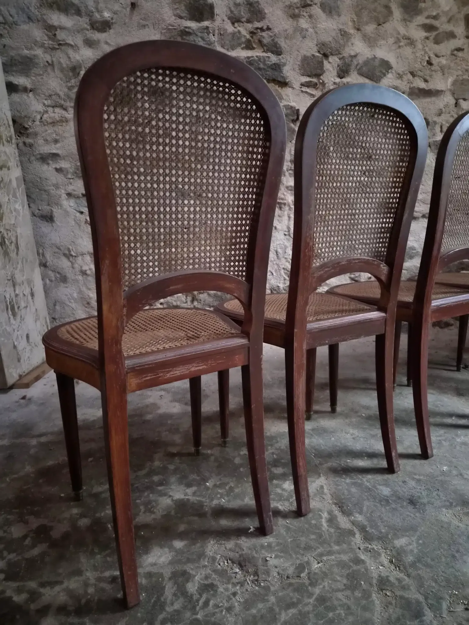 Set of 6 antique Louis XVI style dining chairs with caning.