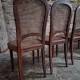 Set of 6 antique Louis XVI style dining chairs with caning.