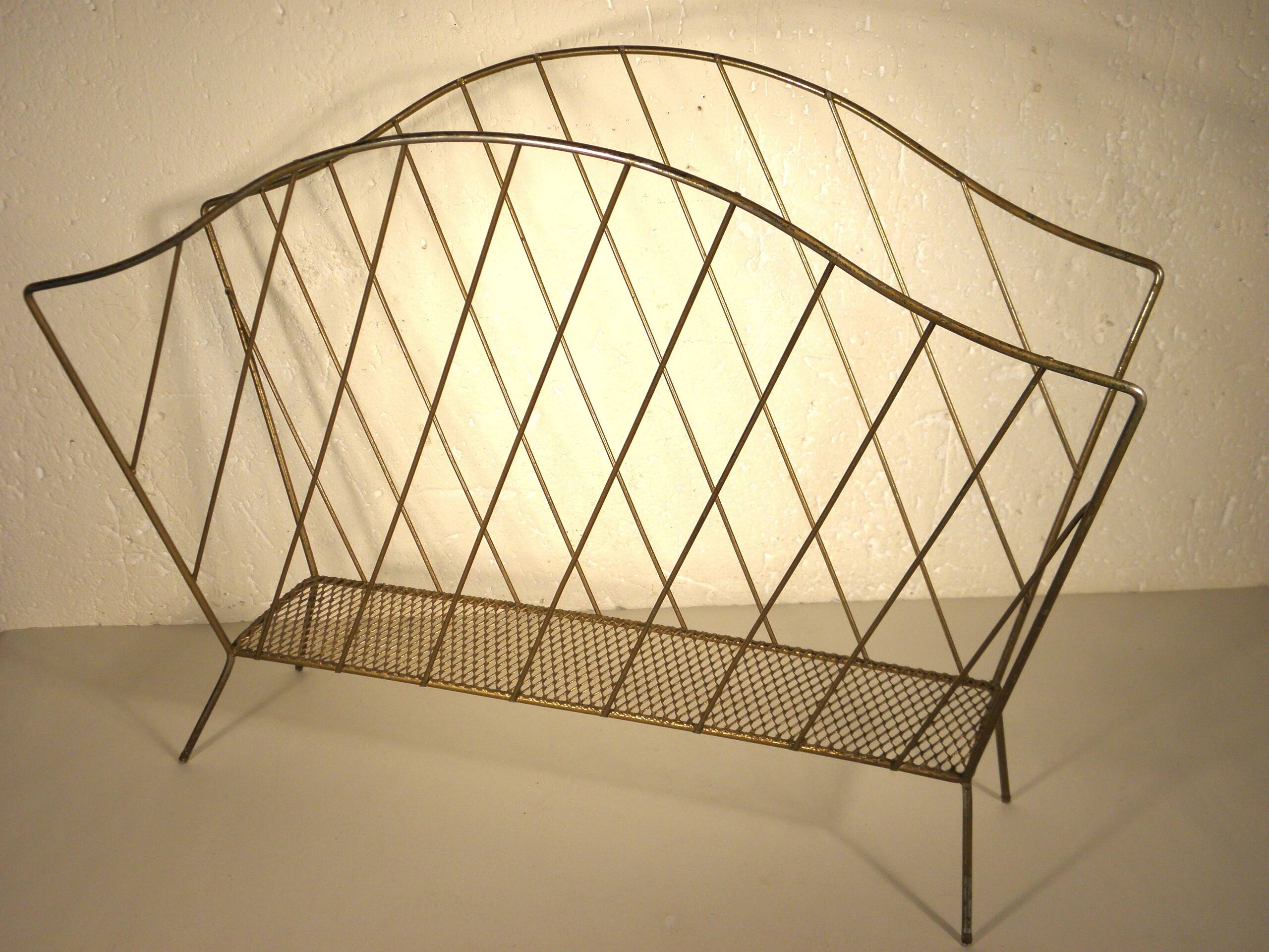 Golden metal magazine rack from the 60s
