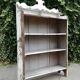 Old white shelf in weathered pine