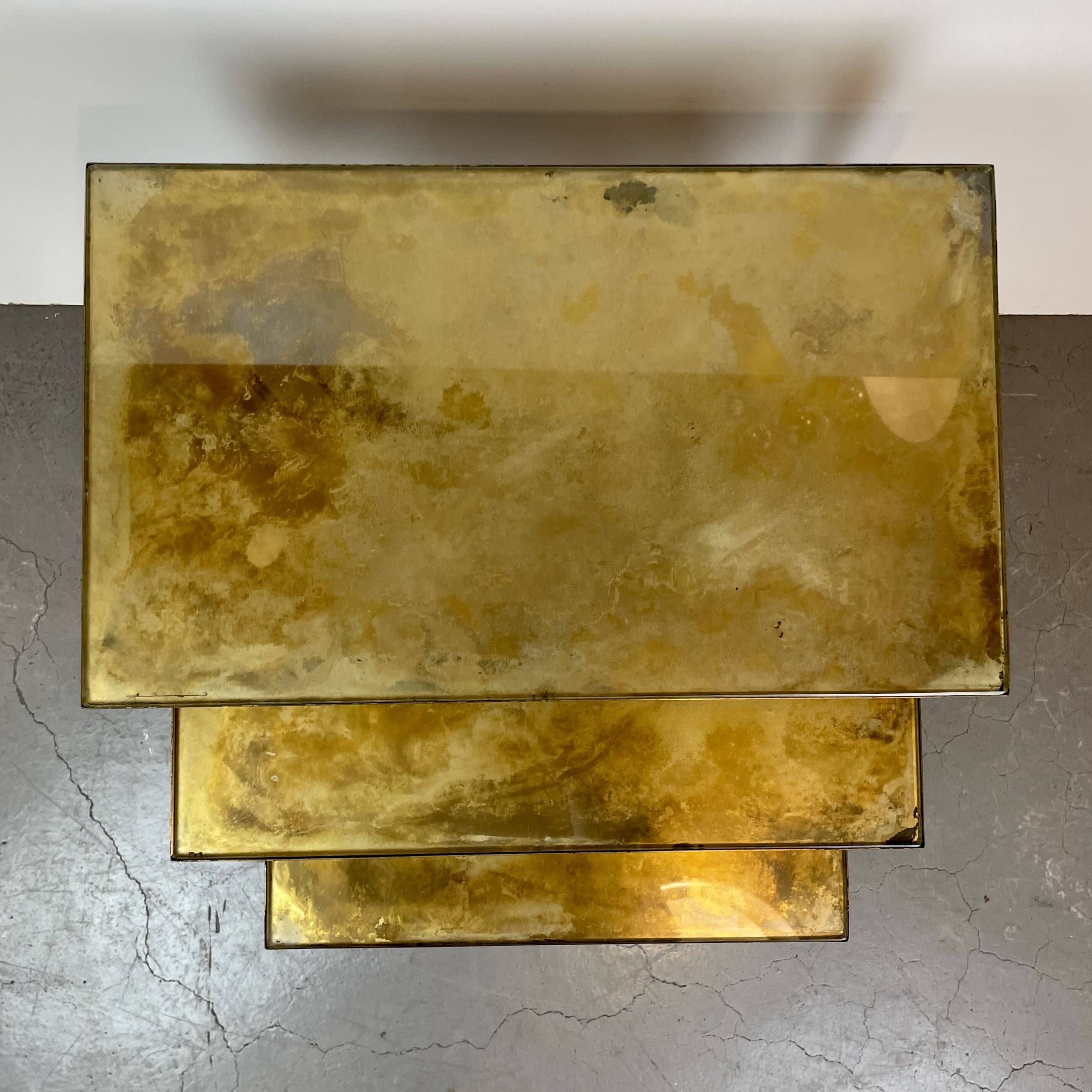 Nested brass tables, attributed to Maison Baguès, France, 1950–60.