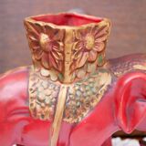 A pair of red and gold ceramic vases in the shape of elephants, 1940s.