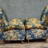 Pair of vintage armchairs with enveloping backrest.