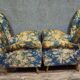 Pair of vintage armchairs with enveloping backrest.