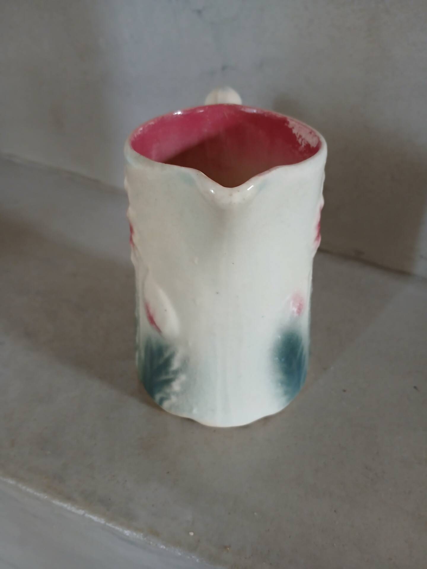 Small antique jug in slipware.
