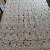 Embroidered crochet tablecloth