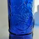 cobalt blue molded glass bottle in relief decoration bunches of grapes