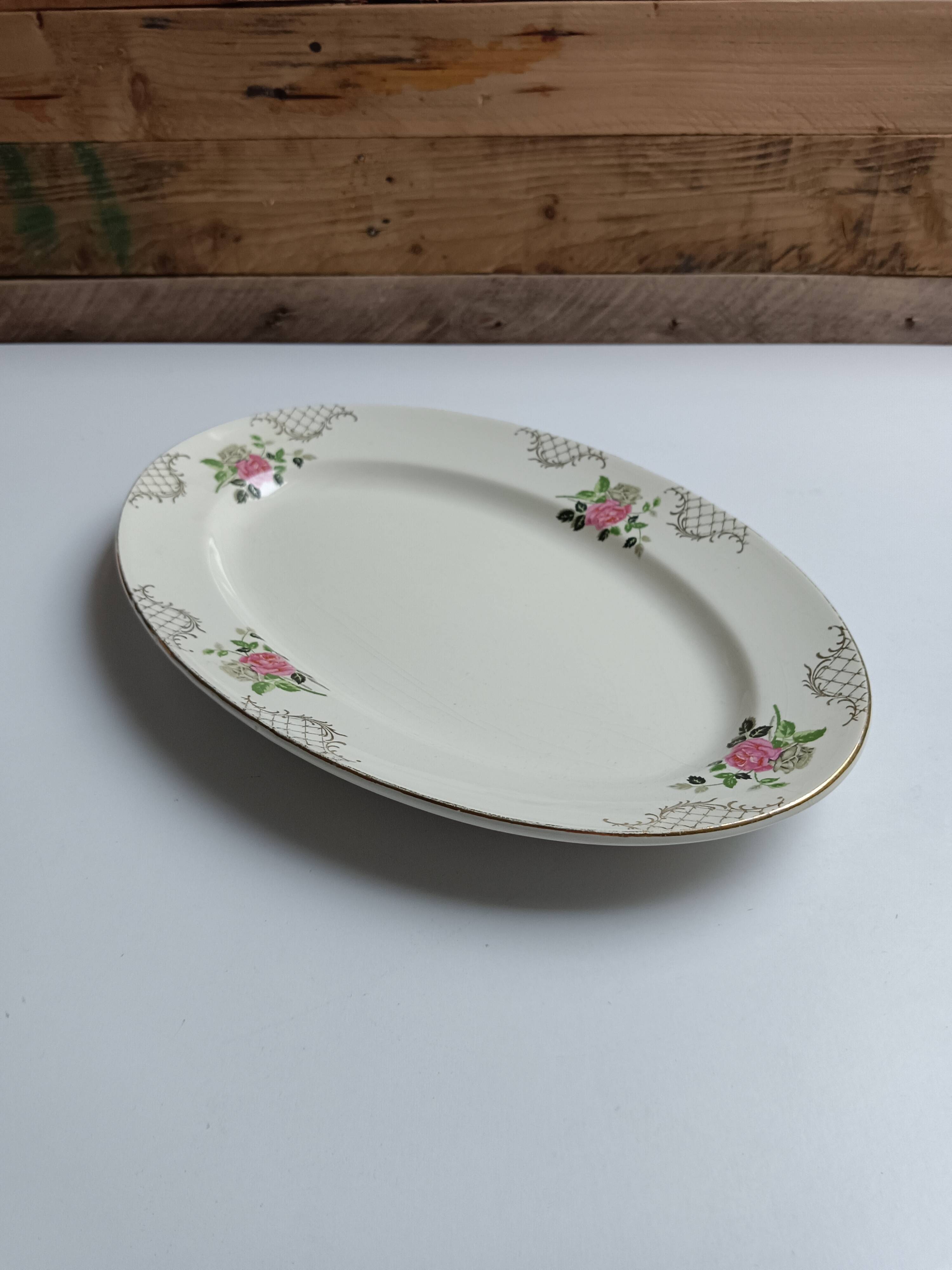 Oval plate Sarreguemines cream with pink gilding, antique.