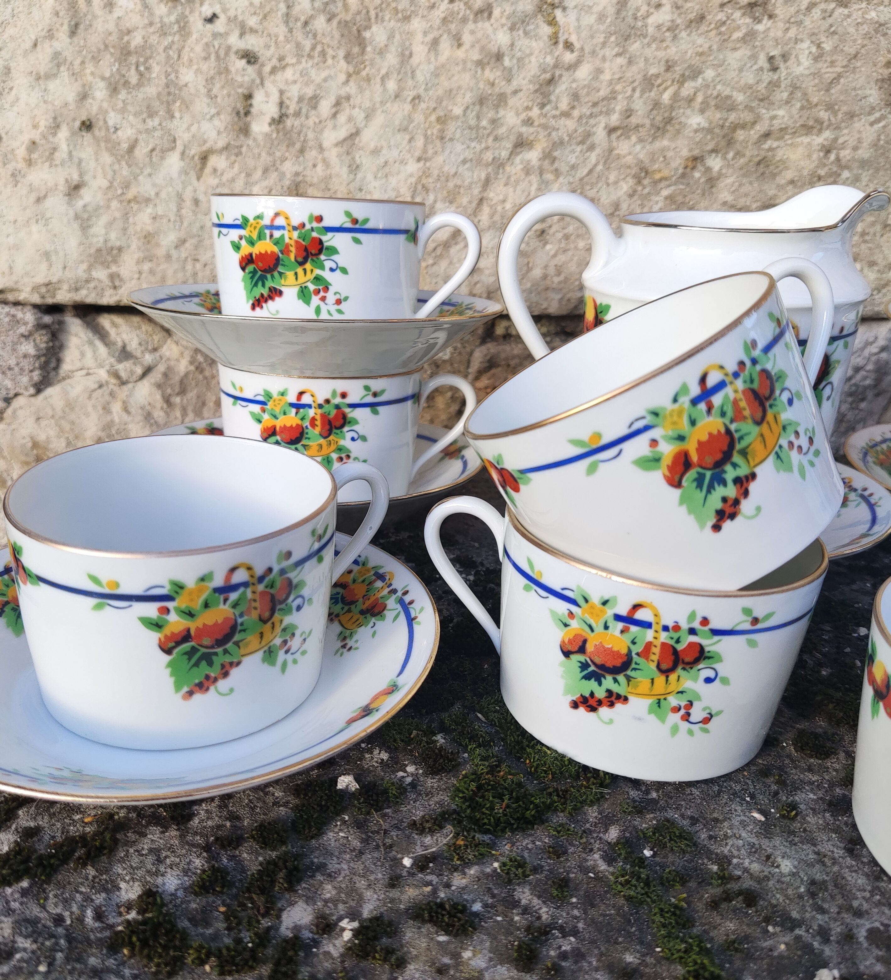 10 tea cups and creamer in Limoges porcelain