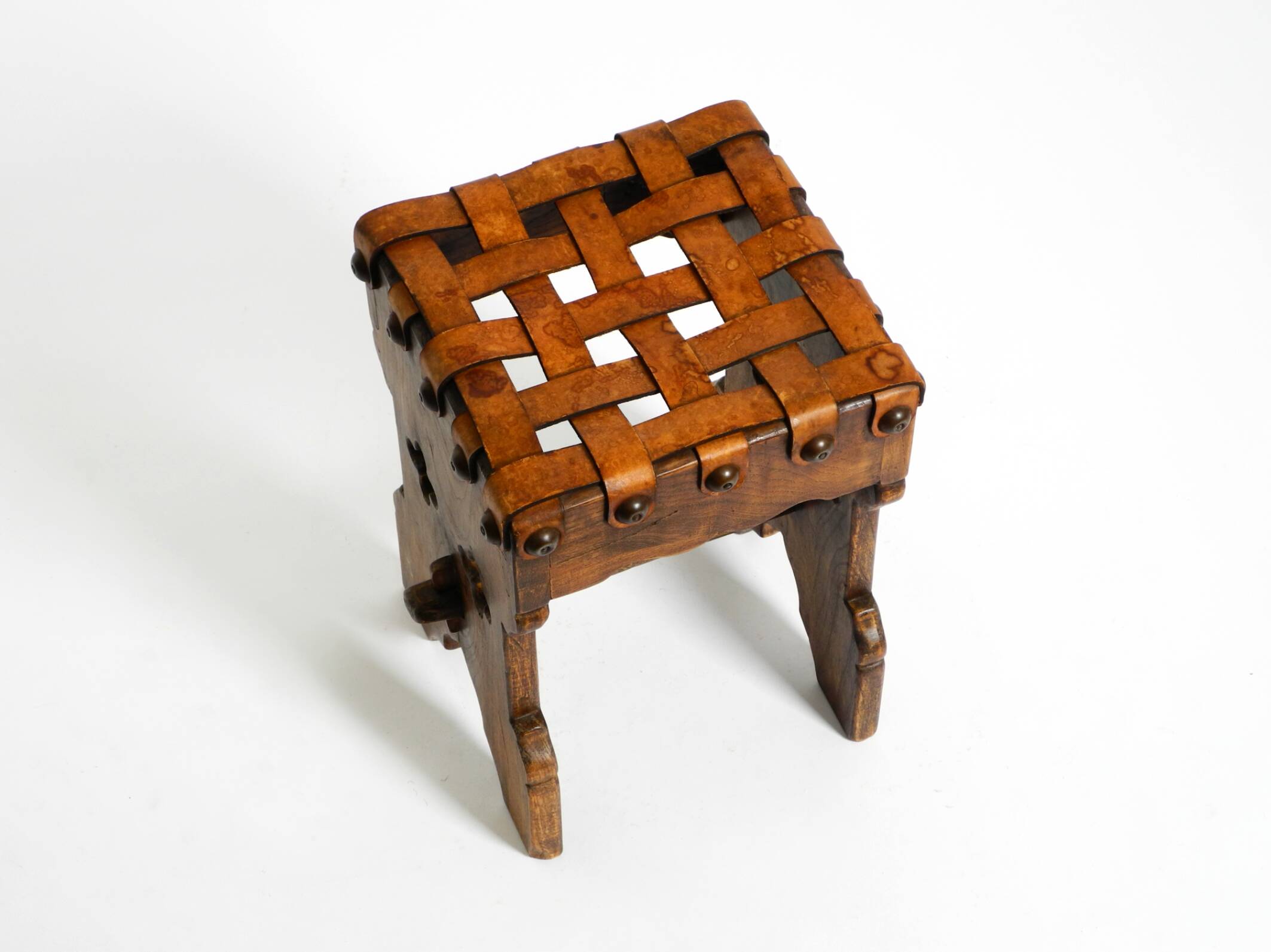 Beautiful 1940s oak stool with a seat made of leather straps