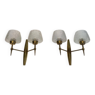 Pair of bronze wall sconces with worked glass reflectors. Stilnovo