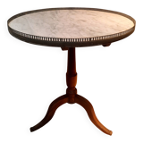 Gueridon circulaire dessu marbre blanc