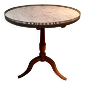 Gueridon circulaire dessu marbre blanc