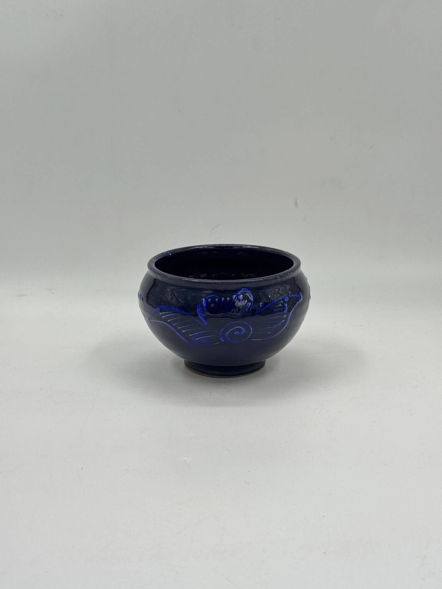Vintage decorative bowl in cobalt blue ceramic.