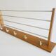 Wall coat rack with hat rack made of teak and gold metal,