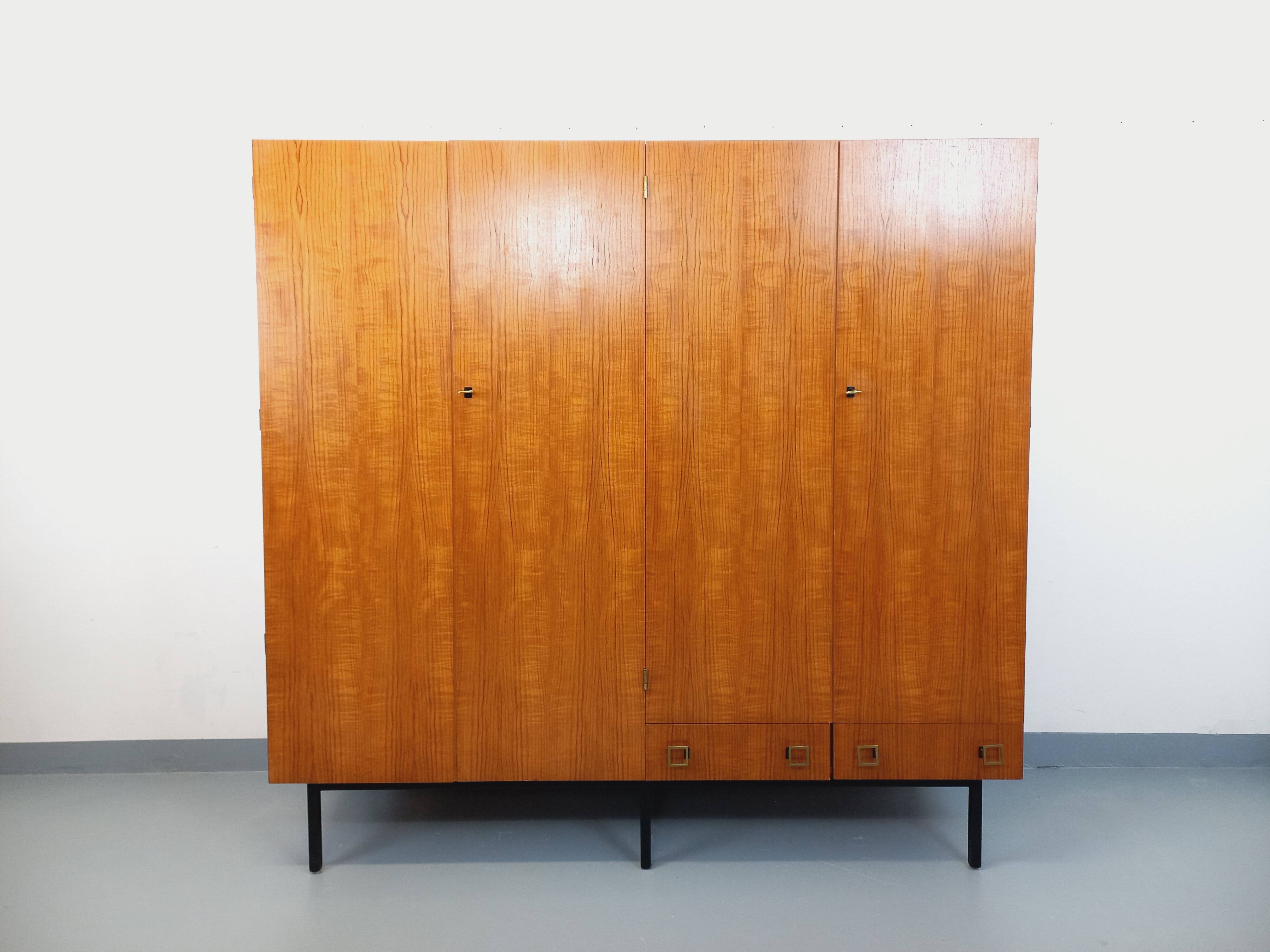 Vintage modernist wardrobe in teak and metal from the 1960s.