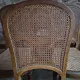 Set of 6 antique Louis XVI style dining chairs with caning.