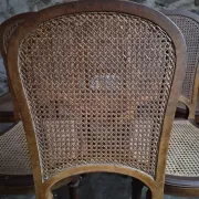 Set of 6 antique Louis XVI style dining chairs with caning.